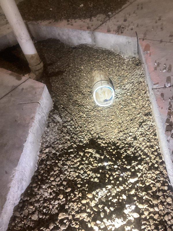 # Underground Plumbing Rough-In Rework

Completed underground plumbing rough-in modifications requiring concrete demolition and excavation in crawl space area. Reworked existing drain and vent piping systems, installing new PVC drainage lines per code requirements. Project completed over 1.5 days with all underground plumbing infrastructure properly installed and inspected.

## Work Performed

Demolished concrete flooring to access existing underground plumbing infrastructure. Excavated and exposed compromised drain lines requiring replacement. Removed deteriorated piping sections and reworked rough-in configuration to meet current plumbing code standards.

Installed new PVC drainage piping with proper slope and grade for optimal flow. Configured vent stack connections to ensure adequate drainage system ventilation. Secured all pipe connections with appropriate fittings and couplings, pressure-testing joints for leak integrity.

Backfilled excavated areas with approved granular materia