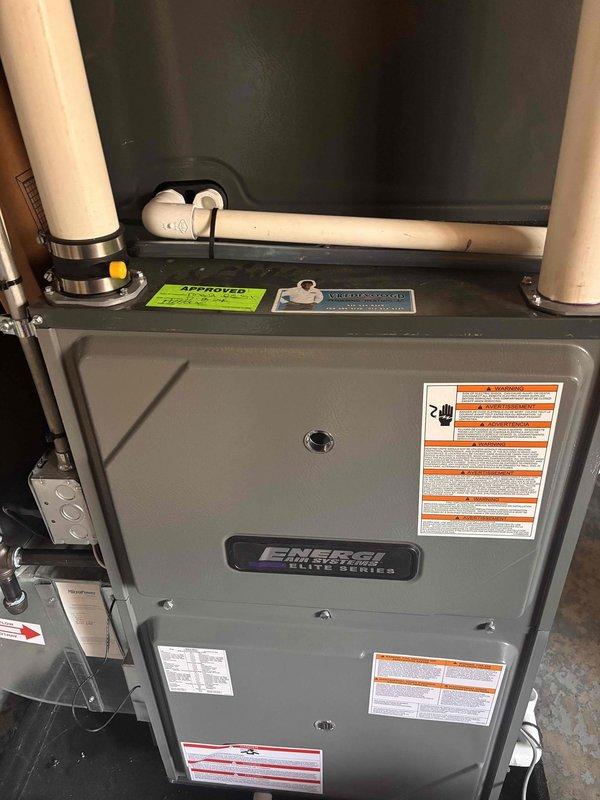 Completed annual heating maintenance on EnergiAir Elite Series high-efficiency furnace (97.0 AFUE rating). Performed comprehensive tune-up including filter inspection, burner assembly cleaning, heat exchanger examination, blower motor lubrication, and combustion analysis to ensure optimal performance for the heating season. Inspected humidifier system, verified proper PVC venting and condensate drainage, confirmed all safety controls operational, and documented equipment condition with photographs for service records.