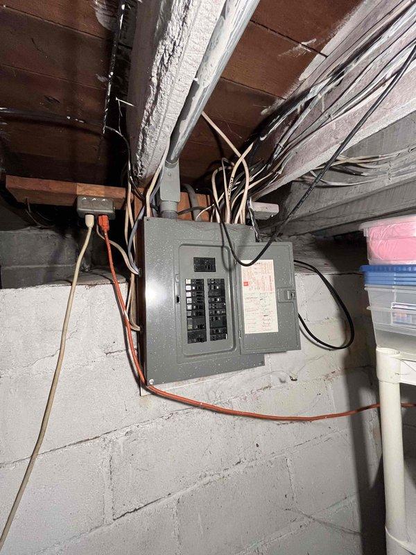 Conducted comprehensive site evaluation for furnace and air conditioning system replacement in residential property. Assessed existing electrical infrastructure, including main panel capacity and circuit availability in basement utility area, to determine compatibility with proposed HVAC equipment. Documented current installation conditions, electrical connections, and structural considerations necessary for proper equipment placement and code-compliant installation.