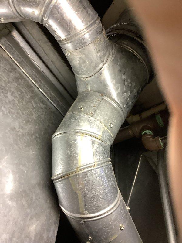 Provided estimate for replacement of 19-year-old Bradford White water heater located in mechanical room alongside existing HVAC equipment. Documented current installation including copper piping connections, brass fittings, and control valves at base of unit for customer review and replacement planning.