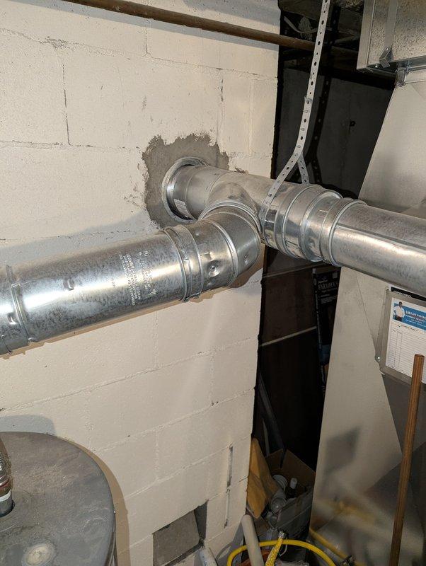 Completed on-site assessment of 40-gallon residential water heater experiencing active leakage requiring replacement. Documented existing unit installation in basement utility area, including current configuration with gas supply line, venting system, and surrounding HVAC equipment. Provided comprehensive estimate for complete water heater replacement with new 40-gallon unit.