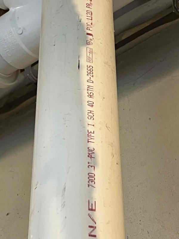 Performed on-site assessment of residential water heater system in basement utility area to provide replacement estimate. Documented existing installation including standard residential water heater with connected expansion tank, copper supply piping, recirculation pump, and PVC drainage system. Photographed current equipment configuration and surrounding plumbing connections for accurate proposal development.