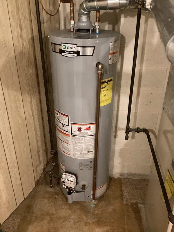 Completed estimate for water heater replacement in residential basement mechanical room. Assessed existing A.O. Smith water heater installation alongside Plus 80v furnace system, documented current configuration including copper piping connections, venting arrangement, and clearance specifications. Photographed equipment layout and provided replacement options for homeowner consideration.
