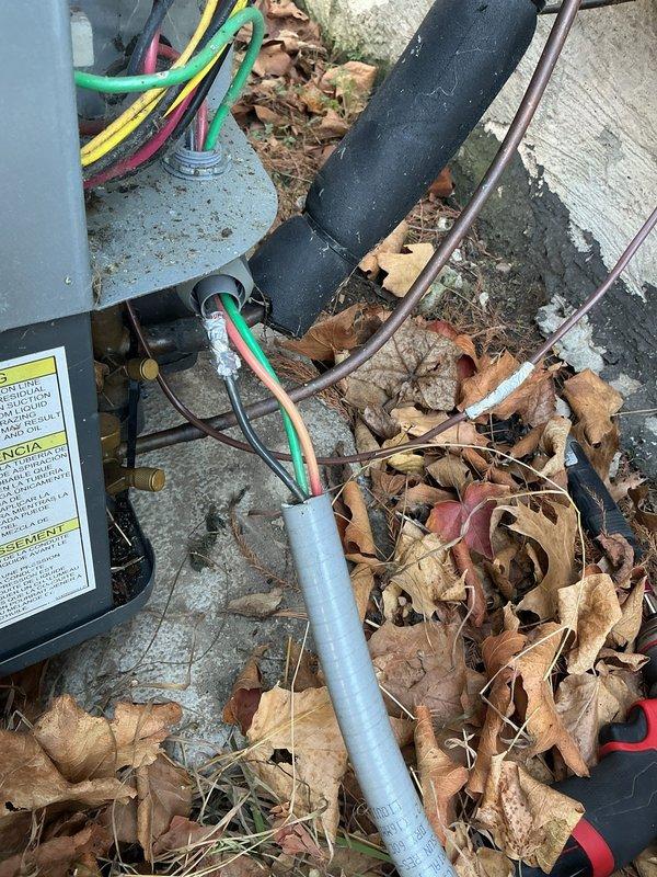 Completed annual cooling system tune-up and maintenance inspection on residential AC unit. Serviced outdoor condenser unit, including cleaning of accumulated debris (leaves and organic matter) from around foundation and equipment area. Inspected electrical disconnect box, refrigerant line sets, copper piping, conduit runs, and insulated suction lines for proper operation and connection integrity. All components found to be functioning within normal parameters, with electrical connections secure and refrigerant lines properly insulated. Unit is operating efficiently and ready for cooling season.