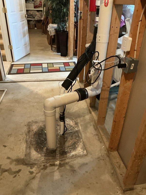 Responded to repeat service call for sump pump running continuously. Upon arrival, inspected sump pump system in basement pit and found pump motor cycling without shutting off, indicating potential float switch malfunction or debris interference. Examined PVC discharge piping assembly and verified proper installation and connections. Tested pump operation and float mechanism to diagnose cause of constant running condition. System evaluated and serviced to restore proper automatic cycling function.