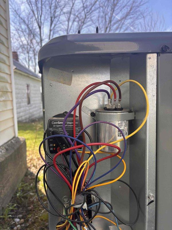 Completed annual heating and cooling maintenance on two 1.5-year-old EnergiAir WT 12-2034 systems. Performed comprehensive furnace tune-up without humidifier service and air conditioning system tune-up on both units. Inspected outdoor condensing unit components including capacitor and CoreSense diagnostic module, verified electrical connections and wiring integrity. Documented significant moisture intrusion in crawl space area with standing water on concrete floor and deteriorated insulation, which may impact system performance and indoor air quality if not addressed.