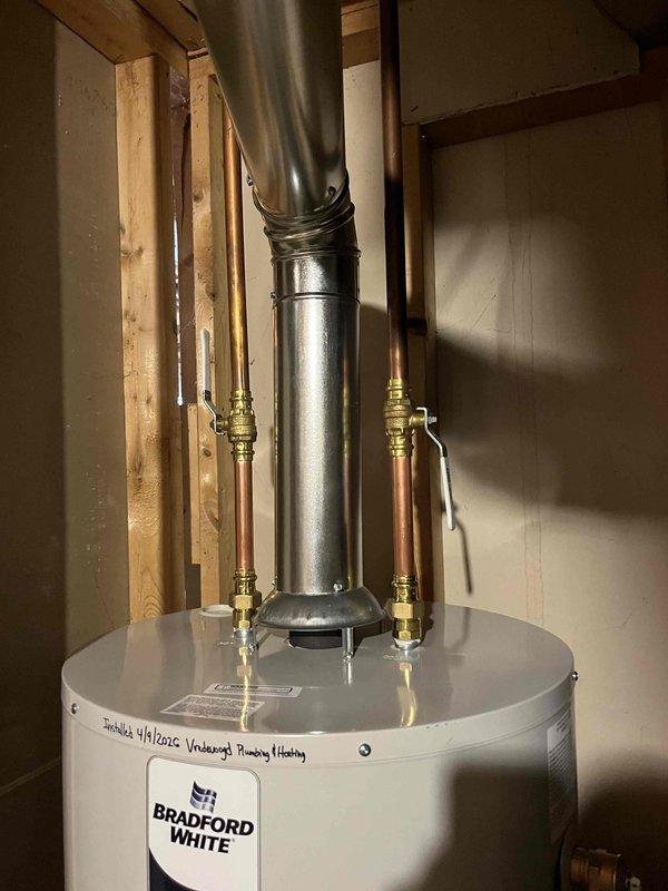 Responded to no hot water complaint and discovered active leak on 15-year-old Bradford White water heater. Verified pilot light operation, inspected pipe connections which were in good condition, and confirmed tank failure requiring complete unit replacement. Provided estimate for new water heater installation.