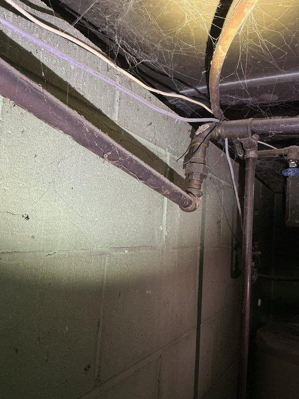 Responded to gas leak call for early availability. Located and repaired two separate gas leaks in basement piping system—one leak identified on gas line serving family room area, second leak found on gas piping behind furnace. Both leaks were addressed, tested for proper seal, and confirmed safe for continued operation.