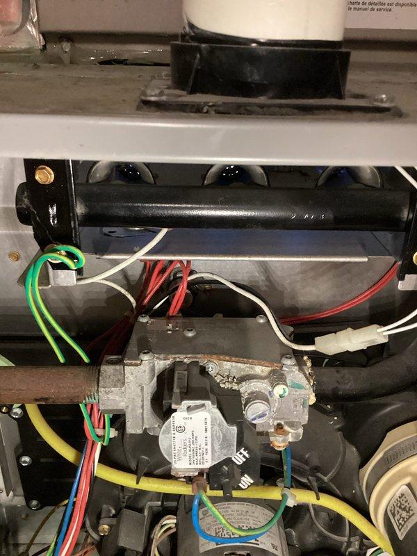 Completed annual heating maintenance on 9-year-old ICP furnace system. Performed comprehensive tune-up including inspection of gas valve assembly, electrical connections, and blower motor components. Verified all color-coded wiring connections at control board and gas valve were secure and properly terminated. Inspected internal compartment for proper operation and component condition. Removed and checked access panel for proper fit and security. All components found to be in satisfactory working condition with normal operational wear. System tested and confirmed operational. Unit does not have humidifier installed. Documentation photos captured for service records.