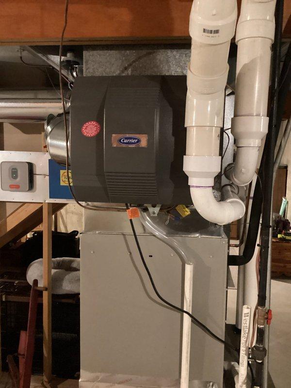 Completed annual cooling maintenance on Carrier HVAC system. Performed comprehensive tune-up inspection of furnace unit and integrated humidifier component. Verified proper operation of all system controls, electrical connections, and PVC venting configuration. Inspected gas line connections, ductwork installation, and humidifier functionality. Confirmed all manufacturer warning labels present and system operating within normal parameters. Unit tested and left in proper working condition for continued seasonal operation.