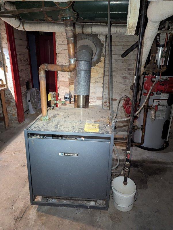 Responded to service call for 2023 AO Smith hybrid water heater displaying error code 44, intermittently tripping circuit breaker, and experiencing reduced hot water output. Inspected unit in basement mechanical room, verified error code on digital display, and examined electrical connections and circuit protection. Documented equipment condition and system configuration with photos showing installation setup, piping connections, and control panel readings for diagnostic evaluation and warranty consideration.