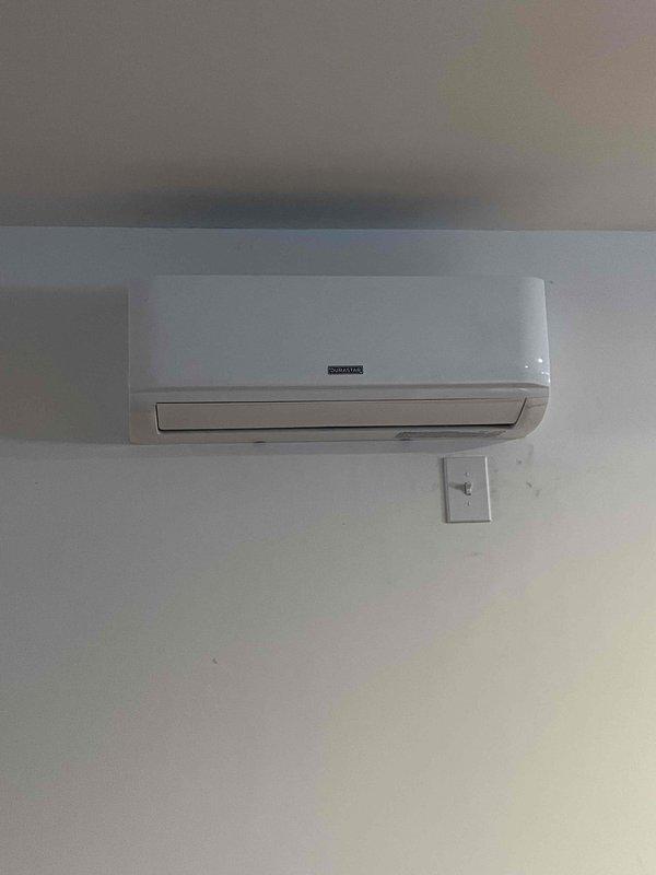 Completed full replacement and installation of unit heater system. Installed new wall-mounted ductless mini-split heating unit on interior wall with associated control switch and thermostat. Ran electrical service including exterior disconnect switch, junction boxes, and conduit routing along exterior corrugated metal siding. Connected gas line with brass fittings and installed service valve panel with proper labeling and weatherproof enclosures for all exterior electrical components.