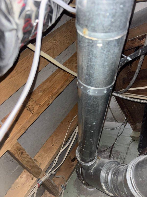 Completed inspector-required corrections on water heater installation. Installed combustion air supply to meet code requirements. Secured water heater vent connections with three screws at each joint per specifications. Added approved support strapping for vertical vent pipe to ensure proper stability and code compliance. System ready for re-inspection.