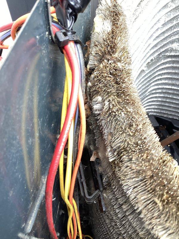 Completed comprehensive Super Tune-up service on 20-year-old air conditioning system and furnace. Upon inspection, discovered significant accumulation of dust, lint, and debris on evaporator coils and cooling fins, severely restricting airflow and reducing system efficiency. Thoroughly cleaned and serviced all HVAC components, removing heavy buildup from coil surfaces. Inspected outdoor condenser unit and associated refrigerant lines, verifying proper connections and line integrity. Tested electrical connections, checked system operations, and documented equipment condition with photos. Both systems now operating at optimal performance levels following complete maintenance service.