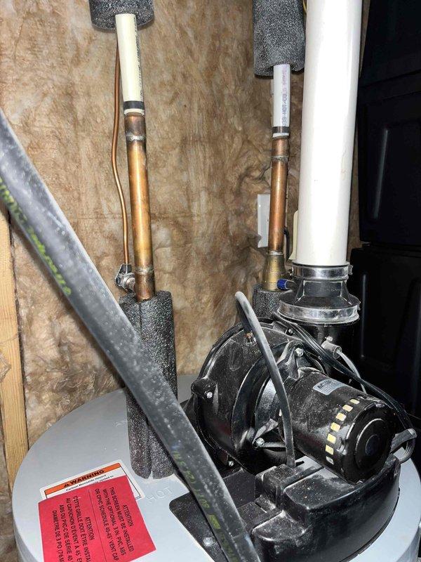 Completed estimate for 9-year-old Lochinvar water heater producing rusty water. Inspected unit and associated piping connections in utility space, documented current system condition with photographs showing plumbing configuration, and provided replacement options to address water quality concerns and aging equipment.