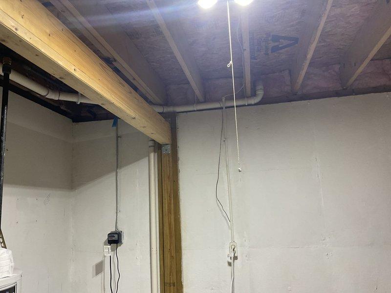 Performed inspection of existing gas line infrastructure in preparation for generator installation. Assessed current gas service location at exterior meter and electrical panel area. Evaluated basement utility space and existing gas piping routing through floor joists to determine feasibility and requirements for extending gas service to proposed generator location. Confirmed adequate access points and clearances for future gas line installation work.