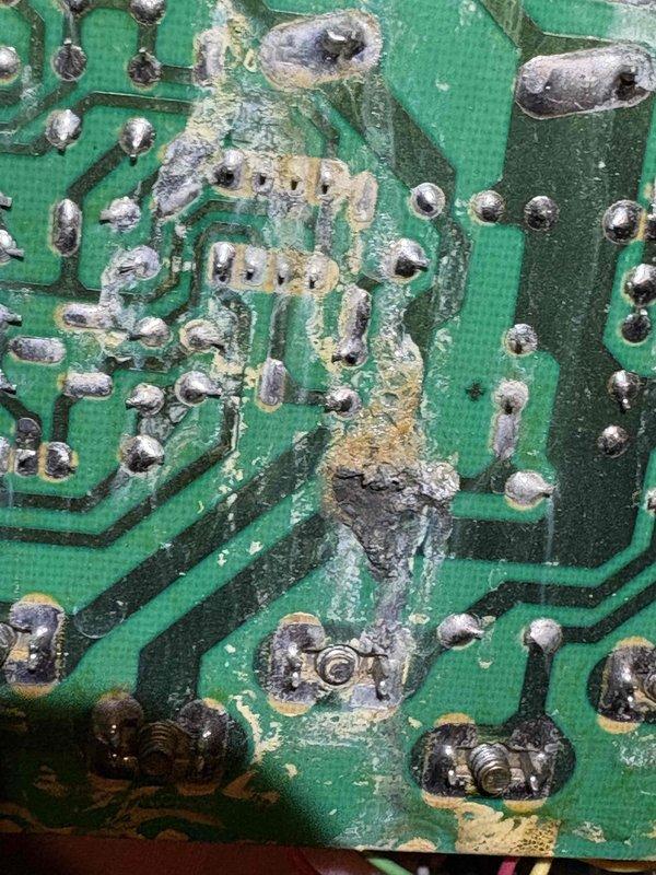 Responded to no heat call where blower was running continuously but producing only cool air. Upon inspection, discovered severe corrosion and moisture damage to the furnace control board, with extensive crystalline deposits and deterioration across the circuit board surface indicating prolonged exposure to environmental factors. Diagnosed failed control board as cause of blower malfunction and lack of heat production. Due to age of system (35+ years), recommended system replacement as most cost-effective solution rather than board replacement on aging equipment.