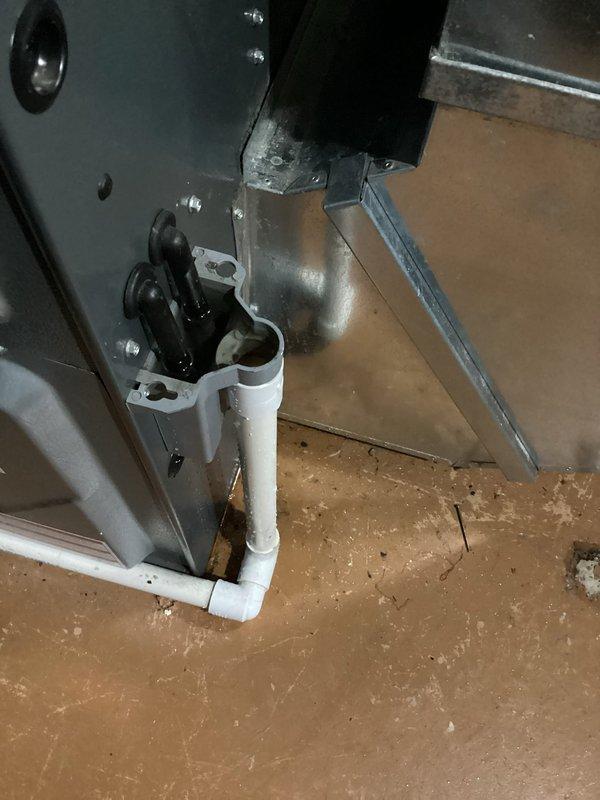 Completed annual cooling maintenance on a 14-year-old EnergiAir system. Inspection revealed significant corrosion and rust staining on condensate drain piping and surrounding floor area, indicating ongoing moisture issues requiring monitoring. All system components were inspected, cleaned, and tested for proper operation per manufacturer specifications.