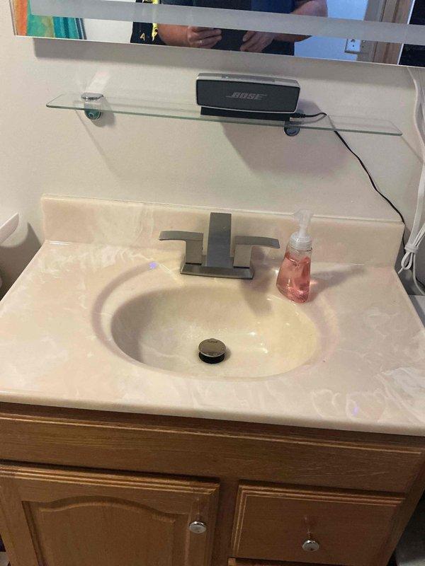 Completed 6-hour quoted repair of bathroom vanity plumbing system. Replaced and reconfigured PVC drain assembly beneath sink, including installation of new P-trap, tailpiece, and drain connections to restore proper drainage and prevent sewer gas infiltration. All components installed to code specifications and tested for proper function.
