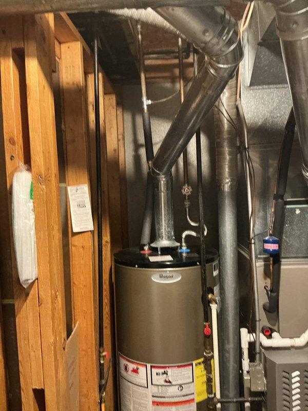 Responded to water leak emergency at residential property. Upon arrival, inspected Whirlpool water heater in basement utility area and surrounding plumbing connections. Assessed leak source, documented existing conditions with photographs, and provided homeowner with containment recommendations and next steps for repair or replacement of affected unit.