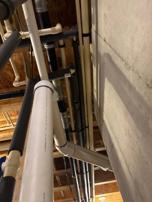 Provided comprehensive estimate for replacement of hot water recirculation pump system in basement utility area. Assessed existing plumbing infrastructure including water heater connections, supply lines, and circulation piping configuration. Documented current system setup with PVC and copper piping, identified pump location and connection points, and evaluated compatibility requirements for new recirculation pump installation.