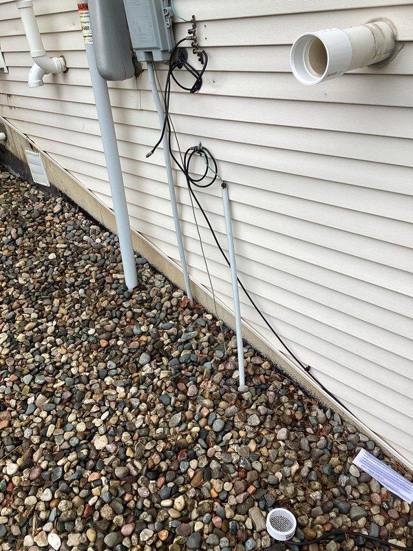 Completed annual cooling maintenance on 2014 EnergiAir system with warranty valid through June 2027. Performed comprehensive tune-up including inspection of outdoor condensing unit, verification of refrigerant levels, electrical connections testing, and assessment of all accessible system components. Documented exterior ventilation and drainage systems with photographs showing proper PVC vent termination with mesh screening and foundation drainage configuration with surrounding landscaping clearances maintained appropriately for equipment operation.