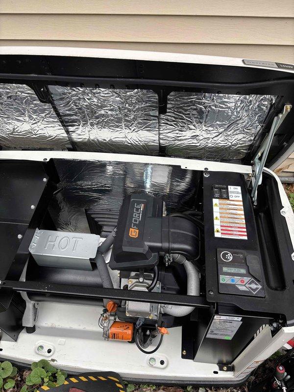 # Generator Preventive Maintenance Service

Performed scheduled preventive maintenance and tune-up on residential standby generator unit. Accessed exterior-mounted generator compartment and conducted comprehensive inspection of all major components including air handling system, electrical connections, and fuel delivery system.

Inspected and verified proper operation of blower assembly and ductwork within the black housing unit. Examined electrical panel connections and warning labels for compliance and visibility. Verified integrity of metallic insulation material in upper compartment section.

Evaluated fuel system components including orange-colored pump assembly and associated piping at base of unit. Inspected FRAM genuine parts oil filter and connected hoses for proper installation and condition. Checked all brass mounting hardware and securing bolts for tightness. Examined multiple connection points, orange protective caps, and black insulated tubing throughout the system for we