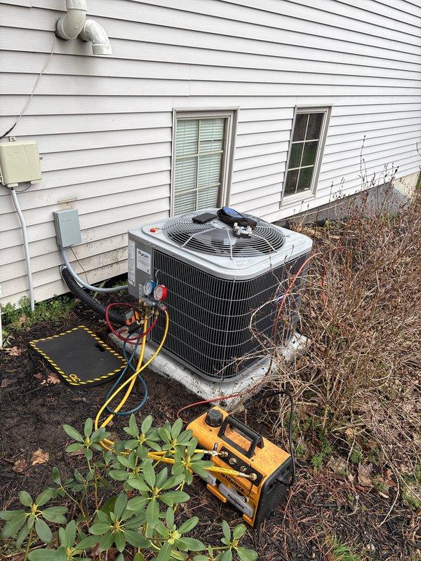 Completed full residential air conditioning system replacement. Removed existing outdoor condensing unit and installed new AC unit on concrete pad with proper refrigerant line connections and electrical hookup. Performed system startup, verified proper operation of compressor and condenser fan, and documented installation specifications including refrigerant charge levels on unit casing for future service reference.