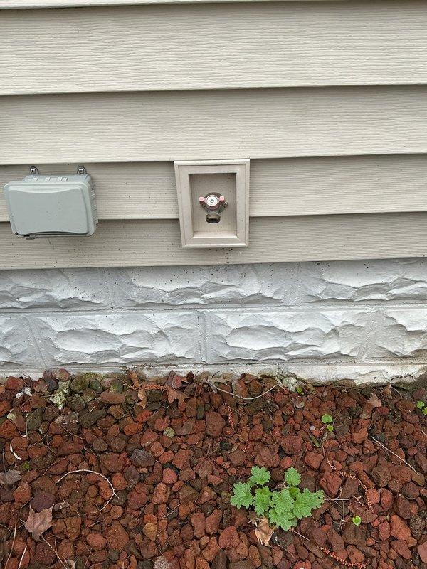 Responded to repeat leak on exterior water line at previously repaired location. Accessed crawl space through side entry to inspect supply line routing and identify source of recurrent failure. Repaired leaking water line connection at exterior hose bib, ensuring proper seal and connection integrity to prevent future failure at same location.
