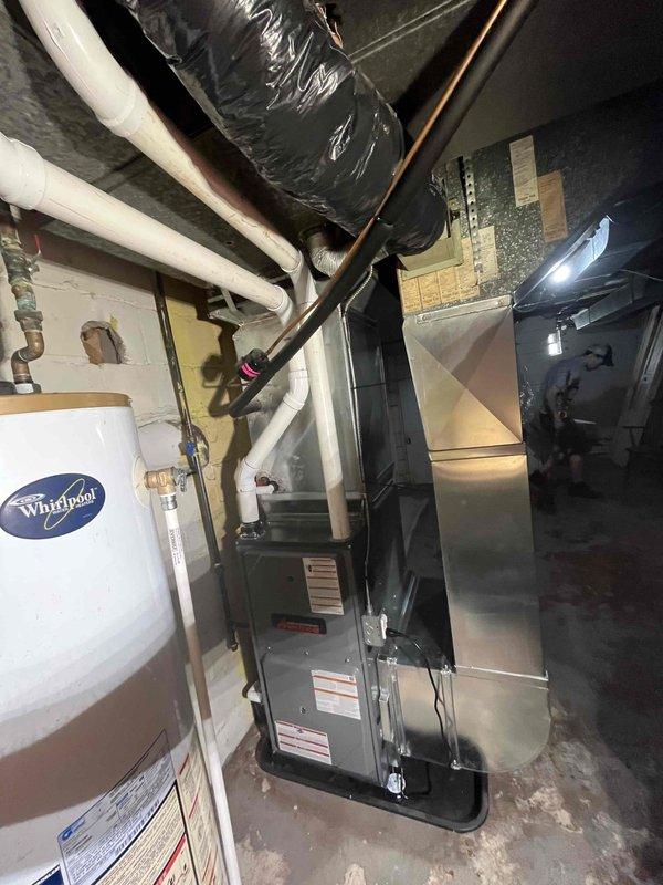 Completed full furnace installation in basement mechanical room. Installed new HVAC unit with proper ductwork connections, including flexible silver ductwork routing and PVC condensate piping. Connected all necessary copper and black piping to integrate with existing water heater system. Verified all electrical connections, mounted thermostat control panel, and ensured proper clearances for service access. System tested and operational upon completion.