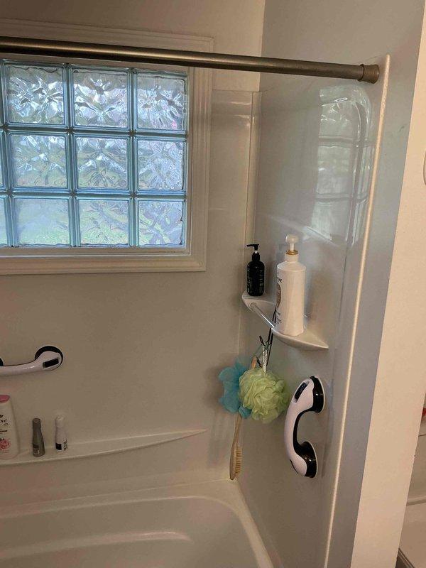 Conducted on-site assessment and documentation for tub/shower to walk-in shower conversion in 1955-era home. Evaluated existing bathtub and shower combination unit with glass enclosure, grab bars, glass block window, and current plumbing configuration to determine scope of work required for accessible walk-in shower installation. Photographed bathroom layout, existing fixtures, wall conditions, and spatial constraints to develop comprehensive project estimate for barrier-free shower conversion.