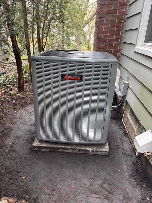 Completed annual cooling maintenance on EnergiAir system. Picked up concrete pad from shop and raised outdoor condensing unit to proper elevation using two technicians and team lead. Unit was previously sitting too low, which could have led to drainage issues and reduced equipment lifespan. Repositioned condenser on new pad adjacent to house exterior with proper clearances maintained for airflow and serviceability. Performed standard AC tune-up including system inspection, temperature diagnostics using thermal imaging equipment, and verification of proper operation. All refrigerant lines, electrical connections, and condensate drainage checked and confirmed operational. Unit now properly elevated on stable concrete pad with adequate clearance from ground surface to prevent water intrusion and improve longevity.