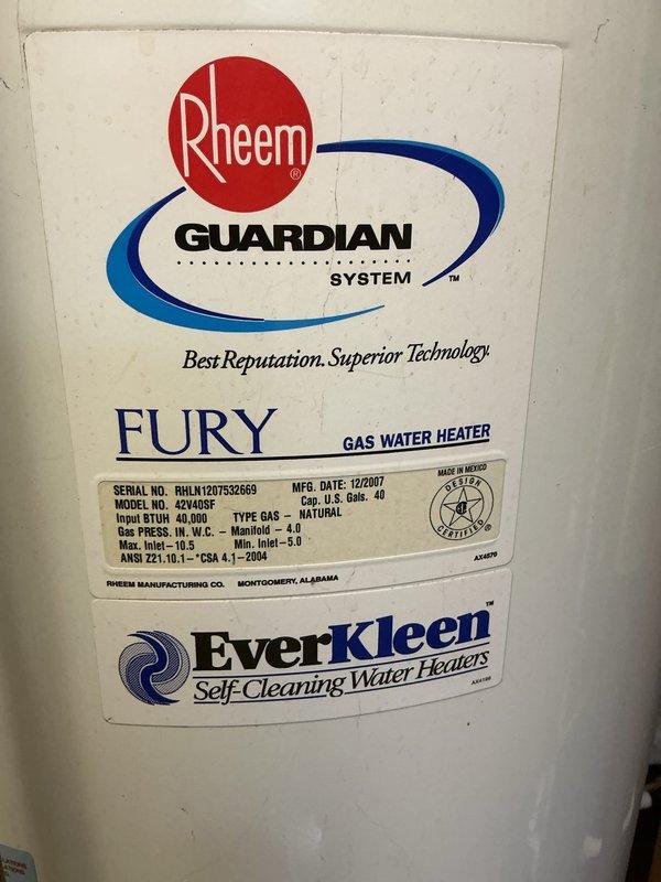 Responded to water leak emergency in basement affecting multiple mechanical systems. Upon arrival, found rainwater intrusion causing standing water that had compromised furnace operation by triggering safety float switch in drain pan. Malfunctioning sump pump was unable to remove water, allowing accumulation around HVAC equipment and Rheem 40-gallon natural gas water heater (Model 42V40SF, manufactured 12/2007). Assessed water damage to furnace, hot water heater, and surrounding plumbing infrastructure including copper gas lines and PVC drainage system. Documented conditions of all affected equipment and water infiltration points for further remediation planning.