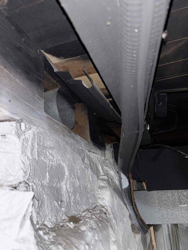 Responded to complaint of heavy sewer gas odor occurring after washing machine cycles following recent installation. Upon inspection, documented HVAC ductwork and mechanical system components in utility area. Investigation revealed improper or missing drain trap configuration on washing machine standpipe, allowing sewer gases to escape into living space when water drained from appliance. Verified mechanical ventilation systems were functioning properly and odor source was isolated to plumbing drain system rather than HVAC components.