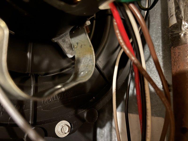 Completed annual heating maintenance on 11-year-old Goodman furnace system without humidifier. Performed comprehensive tune-up including inspection of blower motor assembly, electrical connections, and control components. Evaluated and tested capacitor functionality, inspecting terminals and connections for proper operation. Verified all wire harnesses and electrical connections were secure with appropriate cable management in place. Documented equipment condition with photos showing blower motor housing, mounting hardware, and electrical components in operational status.