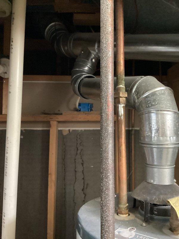 Completed comprehensive rental property inspection including AC tune-up service on residential HVAC system. Inspected and serviced 16-year-old Carrier furnace, 27-year-old Richmond water heater, and air conditioning unit in basement mechanical room. Documented equipment condition with photographs showing proper installation of copper and PVC plumbing connections, ductwork routing, and overall system accessibility for future maintenance.