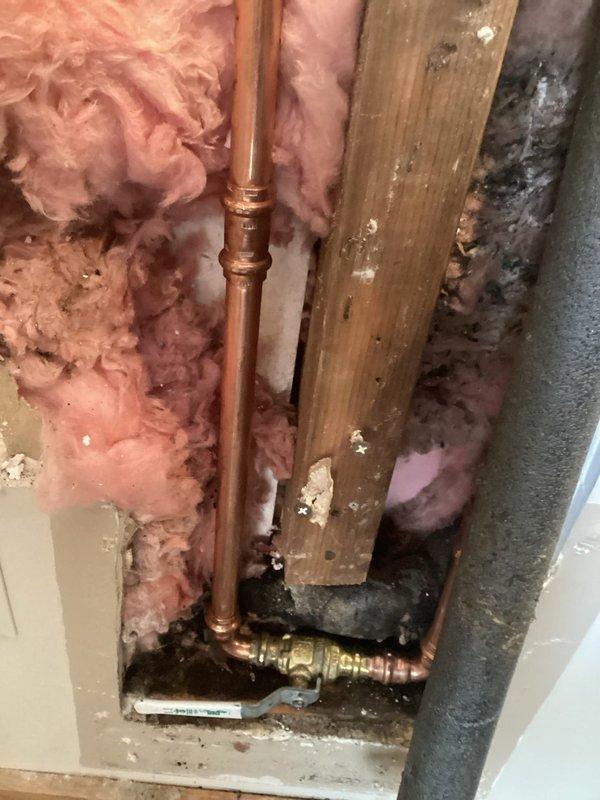 Responded to a plumbing emergency involving two busted 2/3" supply lines feeding outdoor faucets, with one line located in the ceiling cavity. Upon inspection, identified failed copper piping within the wall framing that required immediate replacement. Removed damaged sections of copper supply line, installed new copper pipe with proper fittings and brass valves, and tested all connections for leaks. Restored water supply to both exterior hose bibs and verified proper operation of shutoff valves.