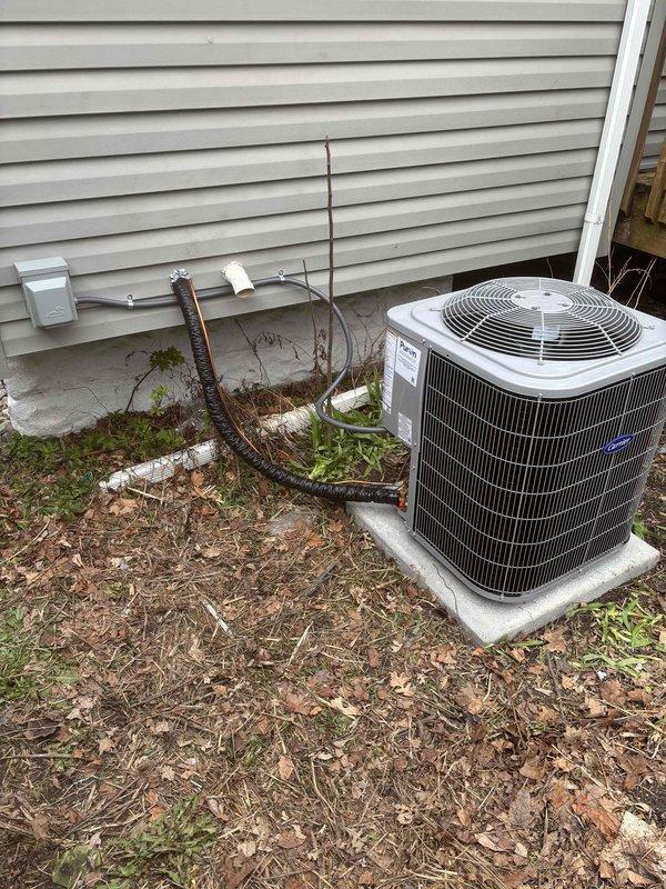Completed add-on air conditioning installation to existing Luxaire furnace system. Installed outdoor condenser unit on concrete pad with proper refrigerant line connections and electrical service. Mounted evaporator coil above furnace in basement with new PVC condensate drain piping. Ran copper refrigerant lines from outdoor unit to indoor coil, performed vacuum and system charge. Verified all electrical connections, tested system operation, and confirmed proper airflow and cooling performance. All required documentation processed and identification verified on file for financing approval.
