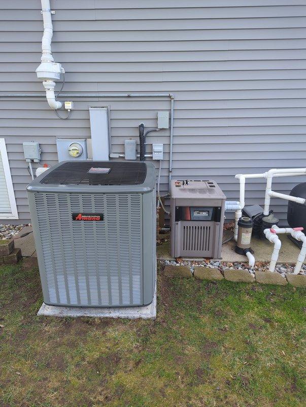 Completed full HVAC system replacement including new furnace and air conditioning condensing unit. Installed outdoor AC unit on concrete pad with proper refrigerant line connections, electrical service, and condensate drainage system using PVC piping. All components properly mounted to exterior wall with code-compliant electrical connections to meter base, system tested and operational.