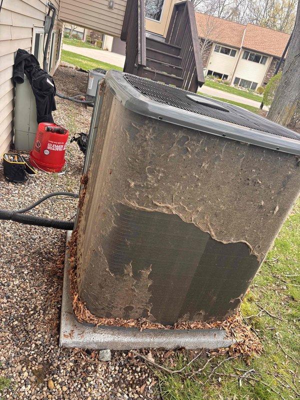 Completed annual cooling maintenance on 2021 EnergiAir system. Performed comprehensive tune-up including inspection of outdoor condensing unit, verified electrical connections at disconnect box, checked refrigerant lines and conduit connections, and cleared debris from base of unit. Noted significant paint deterioration and coating failure on outdoor unit cabinet requiring monitoring for potential rust development, but unit remains operational with all mechanical and electrical components functioning within normal parameters.