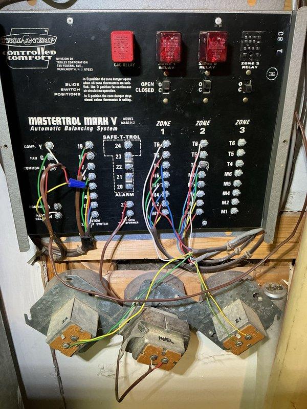 Responded to no-cooling complaint on upstairs zone following recent tune-up on 2-year-old ICP system. Upon arrival, inspected Mastrol Mark V automatic balancing system with Honeywell Controlled Comfort zoning control panel. Found Zone 2 damper actuator had failed to respond to thermostat call, preventing airflow to upstairs area. Verified proper 24V power supply to zone control board and tested all three zone damper positions. Discovered damper motor for affected zone had lost communication with control module. Checked all terminal connections on zone panel, confirmed proper wiring at T-terminals and M-terminals, and verified transformer output voltage. Cycled zone switches and tested each zone independently to isolate the issue. Reset control board and recalibrated damper positions, restoring proper operation to all zones including the previously non-functional upstairs zone. Confirmed adequate airflow and proper damper movement through all zones during system operation. System tested