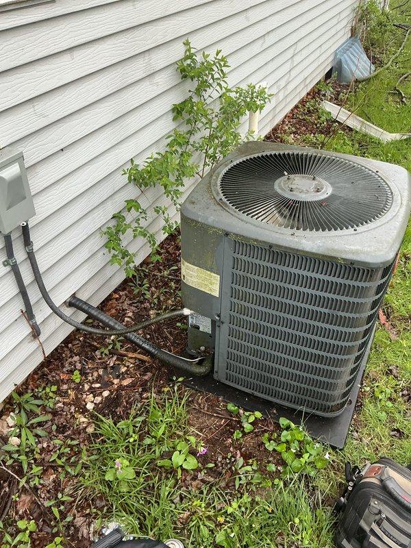 Completed annual cooling maintenance on 8-year-old residential air conditioning system. Performed comprehensive tune-up including inspection of outdoor condenser unit, verified proper electrical connections at disconnect box, checked refrigerant levels, cleaned condenser coils, and tested system operation. Unit operating within normal parameters with no immediate service needs identified.