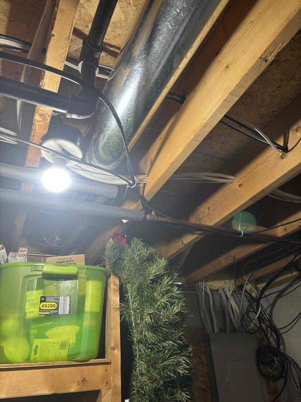 Conducted on-site consultation for refrigerator water and ice maker line installation in kitchen of 30+ year old home. Assessed existing plumbing infrastructure in basement area, including current water supply routing, drain configurations, and accessibility for new line installation. Reviewed multiple installation options with homeowner, discussing routing possibilities through basement ceiling joists to kitchen location, connection methods to existing water supply, and code-compliant installation requirements for the new dedicated water line.