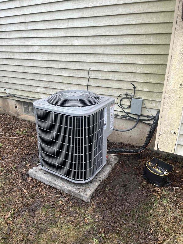 Successfully completed installation of new residential air conditioning condenser unit and water heater system. The outdoor AC unit was positioned on a concrete pad against the exterior wall with proper electrical connections, disconnect box, and conduit routing installed per code requirements. In the mechanical room, installed a new cylindrical water heater with copper supply piping, brass fittings, and flexible aluminum venting properly routed and secured. All plumbing connections were completed and tested for leaks, and the venting system was installed to manufacturer specifications for safe exhaust operation.