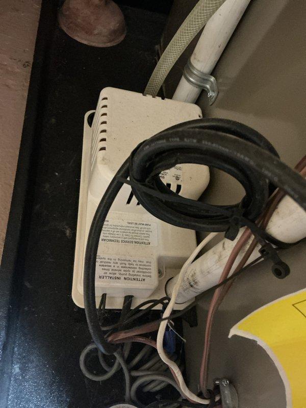 Completed annual cooling maintenance on a 6-year-old air conditioning system with active club membership covering furnace, AC, and humidifier. Performed comprehensive tune-up including inspection of indoor air handler unit and outdoor condensing unit. Cleaned electrical disconnect panel which showed significant moss and organic debris accumulation, posing potential safety and performance concerns. Removed vegetation growth from interior of electrical enclosure and verified all electrical connections were secure. Inspected contactor, capacitor, and wiring connections. Checked refrigerant lines, condensate drainage system, and all mechanical components for proper operation. Documented equipment condition with photos showing both indoor mechanical components and outdoor electrical panel. System tested and confirmed operational following maintenance procedures.