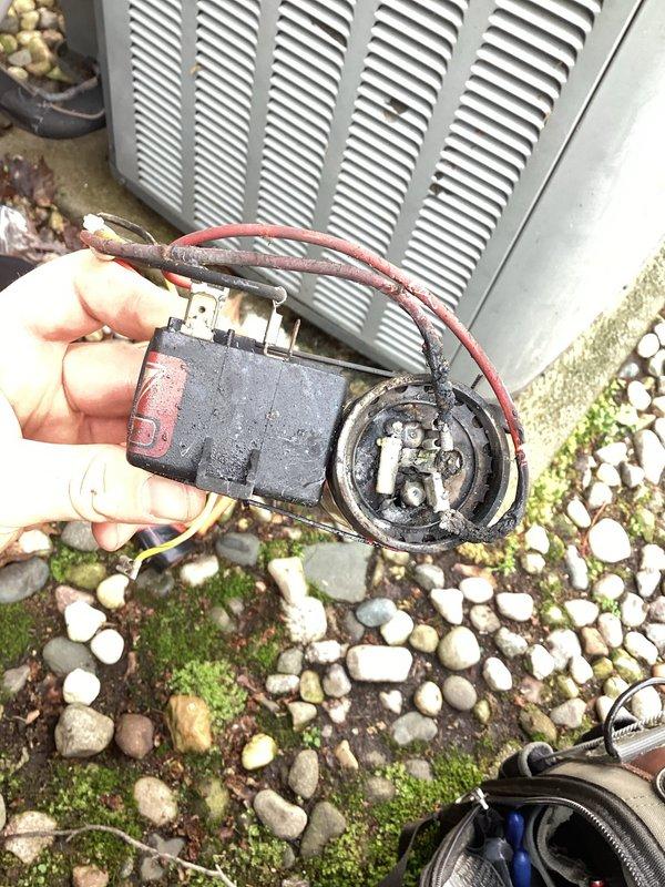 Responded to service call for 16-year-old air conditioning unit experiencing overheating and electrical burning odor. Upon inspection, identified failed dual run capacitor with severe corrosion on terminals and visible deterioration of electrical connections. Removed defective capacitor from condenser unit and replaced with new component to manufacturer specifications. Verified proper wire connections, tested system operation, and confirmed unit running at normal temperatures with no abnormal odors present.