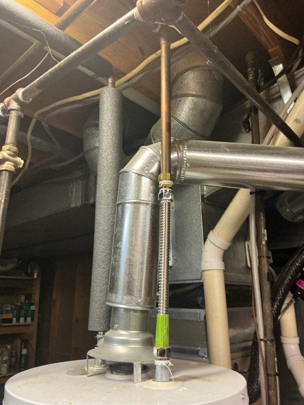 # Water Heater Tune-Up Completed

Performed comprehensive tune-up service on a 12-year-old Craftmaster water heater unit. Conducted thorough inspection of all plumbing connections, including copper supply lines, PVC drainage piping, and flexible braided water supply hoses. Verified proper operation of temperature and pressure relief valve, checked for signs of corrosion or leakage at tank connections, and examined the condition of all pipe insulation throughout the system. Inspected ductwork connections and HVAC integration points in the mechanical room. All components found to be functioning within normal parameters, with system operational and ready for continued service.