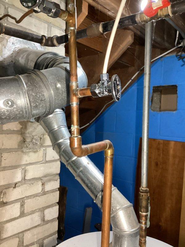 Conducted water heater replacement estimate for a 22-year-old existing unit that has reached end of serviceable life. Documented existing plumbing configuration including copper supply lines, shut-off valves, and connection points in the mechanical room, and assessed installation requirements for new water heater replacement.