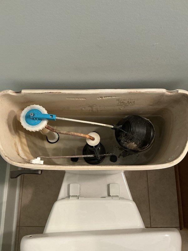 Replaced two outdated sink fixtures in separate areas of the residence with new vanity and plumbing connections. Successfully installed bathroom vanity unit with integrated white countertop sink basin, light wood cabinetry, and completed all water supply and drain line connections to ensure proper functionality.