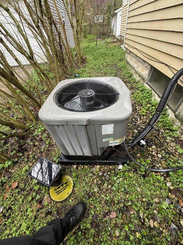 Responded to no-cooling complaint on 9-year-old residential air conditioning system. Upon arrival, found outdoor condensing unit running but fan motor not operating, creating abnormal noise. Breaker had been shut off by homeowner prior to arrival. Inspection revealed significant corrosion and deterioration on refrigerant line, indicating potential leak and system contamination. Condenser fan motor failure confirmed as primary issue preventing proper heat rejection and cooling capacity. Unit requires fan motor replacement and refrigerant line repair to restore normal operation.